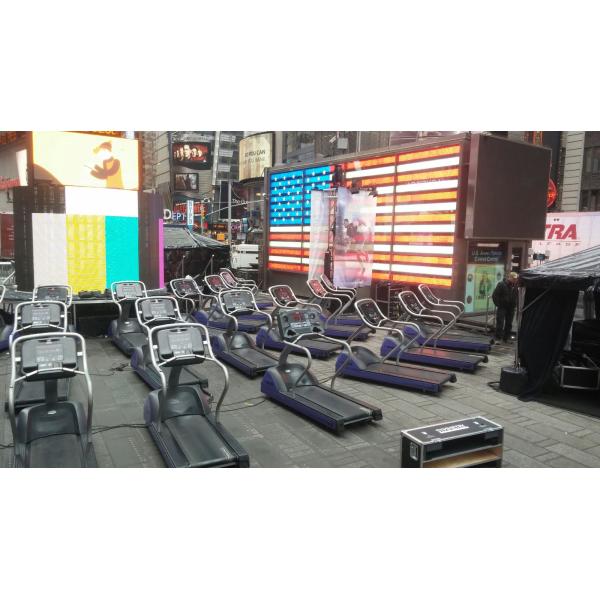 A row of new treadmills in front of an American flag. A row of new treadmills in front of an American flag.