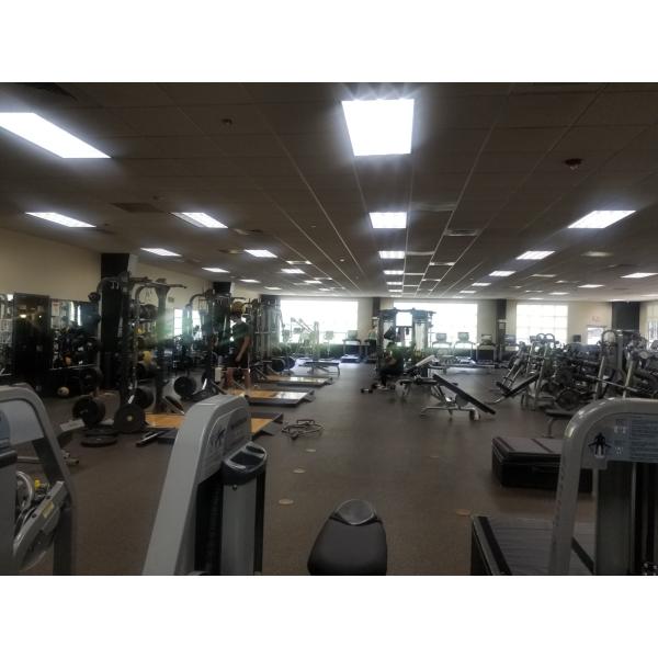 A spacious room filled with new exercise equipment.