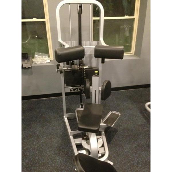 A gym machine in a room with other new equipment. A gym machine in a room with other new equipment.