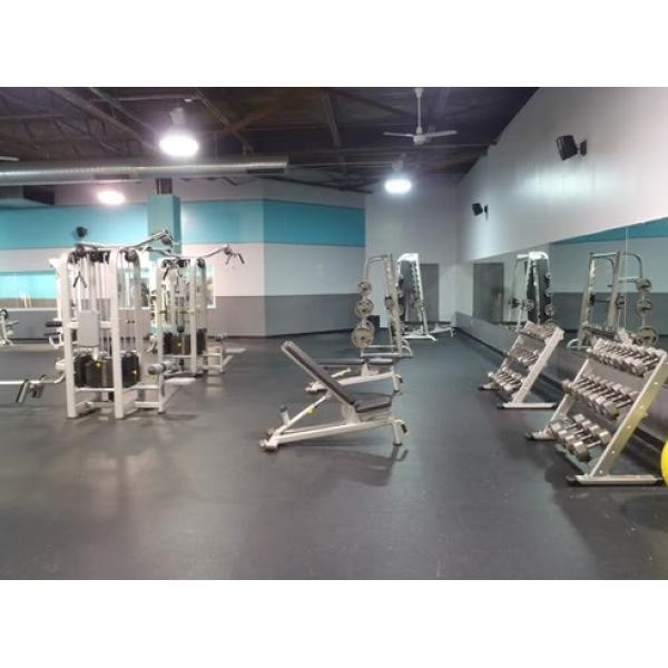 A gym with both new and remanufactured exercise equipment. A gym with both new and remanufactured exercise equipment.
