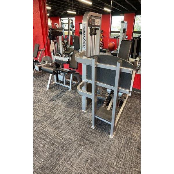 A group of New & Remanufactured Gym Equipment in a gym. A group of New & Remanufactured Gym Equipment in a gym.