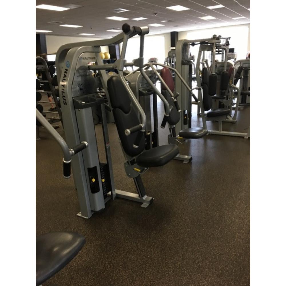 A gym with a lot of new and remanufactured machines and equipment.
