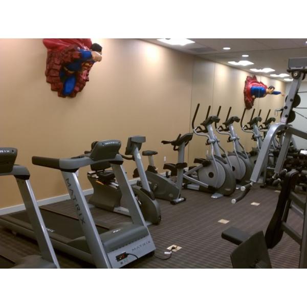A new gym room with a superman statue on the wall. A new gym room with a superman statue on the wall.