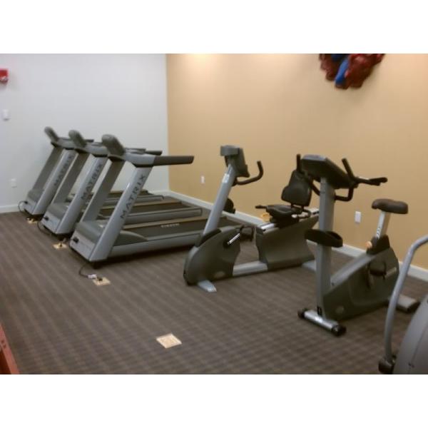 A room filled with a selection of new and remanufactured exercise machines. A room filled with a selection of new and remanufactured exercise machines.
