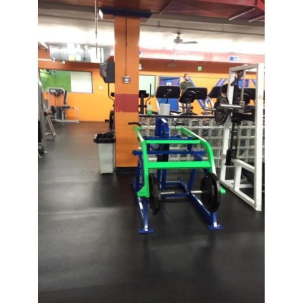 A gym with new and remanufactured green and blue equipment.