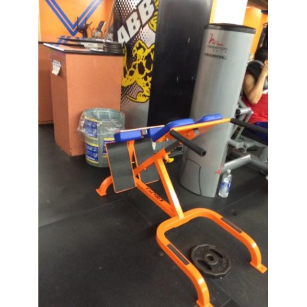 A gym with a new blue machine on the floor.