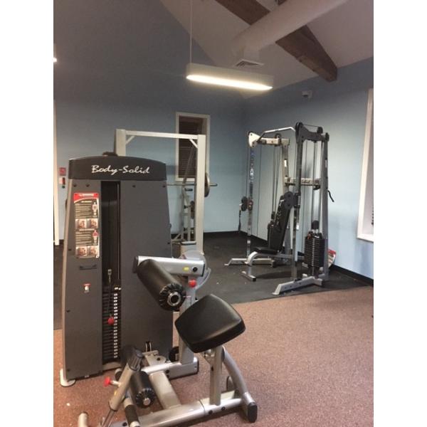 A gym room with a variety of new and remanufactured gym equipment. A gym room with a variety of new and remanufactured gym equipment.