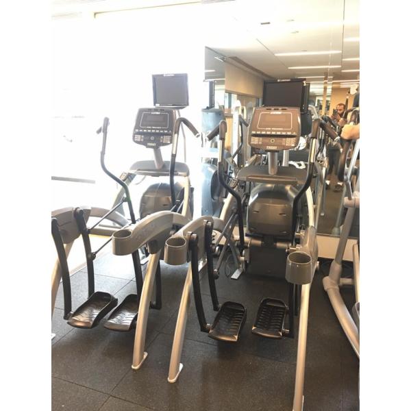 New and remanufactured elliptical machines in a gym with mirrors. New and remanufactured elliptical machines in a gym with mirrors.
