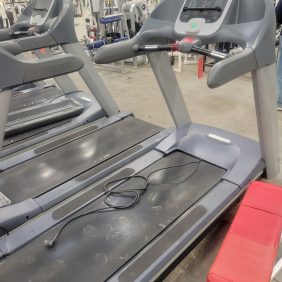 A group of **Precor TRM954i Treadmills- As Is $600** in a gym.