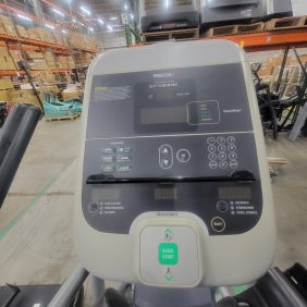 This description is for a Precor EFX 534i - Serviced treadmill in a warehouse with a display screen.