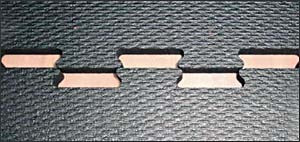 Four 4'x4' Interlocking Sports Mats (10% Fleck) on a sleek black surface.