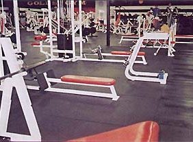 A gym with a lot of 4'x6' Black Bully Mats.