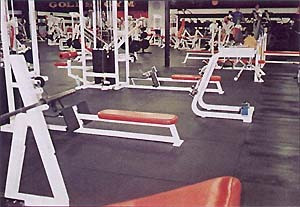 A gym with a lot of 4'x6' Black Bully Mats.