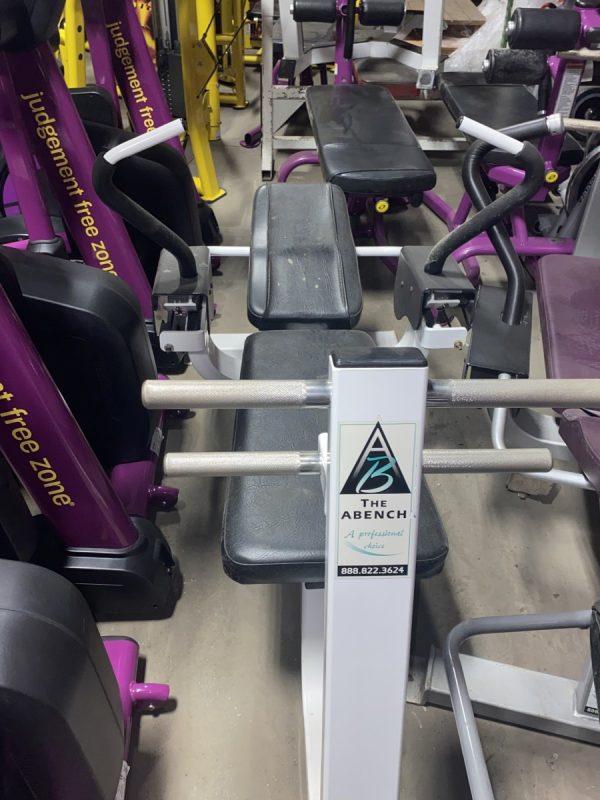 A group of The Abs Co. The Abs Bench - As Is Functional gym equipment, including both new and remanufactured pieces, can be found in this gym.