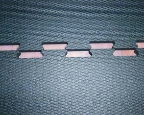 A set of four Anti-Fatigue Mats (Light Duty) on a black surface, suitable for both new and remanufactured gym equipment.