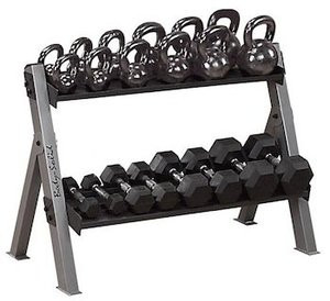 A rack with several Body Solid Dumbell/Kettleball Rack - New kettlebells and weights on it.