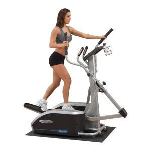 A woman on a Body-Solid Elliptical Trainer E400 - New.