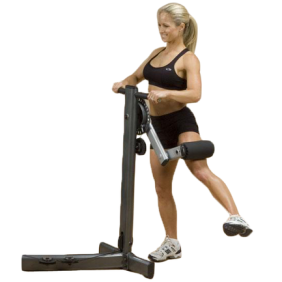 A woman utilizing a Body Solid Fusion Multi Hip Attachment - New on a white background, surrounded by new and remanufactured gym equipment.