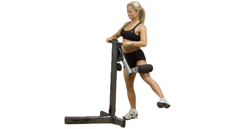 A woman utilizing a Body Solid Fusion Multi Hip Attachment - New on a white background, surrounded by new and remanufactured gym equipment.