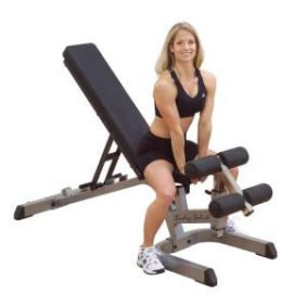 A new woman is posing on a Body Solid Heavy Duty Flat / Incline / Decline Bench - New.
