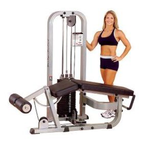 A woman standing next to a Body Solid Selectorized Pro Clubline Leg Curl Machine 210 lbs Stack - New.