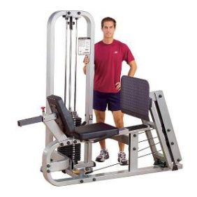 A man standing next to a Body Solid Selectorized Pro Clubline Leg Press Machine 310 lbs Stack - New.