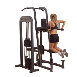A woman is effortlessly performing a pull up on the Body Solid Selectorized Weight Assisted Knee Raise, Dip, & Chin Machine - New.