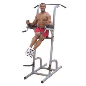 A man utilizing a Body Solid Vertical Knee Raise, Dip Station & Pull Up - New at the gym.