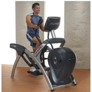 A man on a Cybex 750AT Total Body Arc Trainer - Remanufactured.