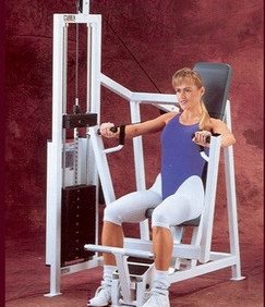 A woman exercising on a Cybex Classic Selectorized Chest Press - Remanufactured gym machine.