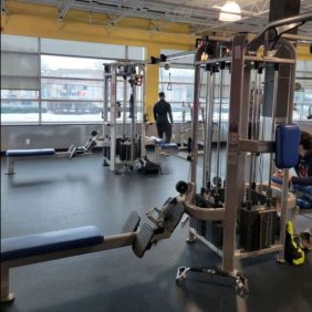 A gym with a lot of Star Trac 8 Station Multi-Gym - Serviced equipment in it.