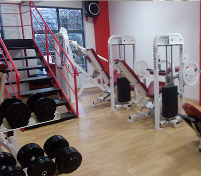 A gym room filled with a wide range of new and remanufactured gym equipment.