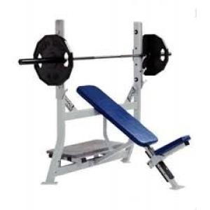 A Hammer Strength Olympic Incline Bench - Remanufactured with new and remanufactured gym equipment, including a weight plate.
