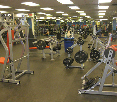 A gym with a wide selection of new and remanufactured gym equipment.