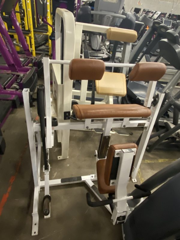 A group of Hammer Strength Tricep Extension - As Is Functional equipment in a gym.