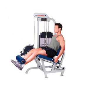 A man is sitting on a Life Fitness PRO Leg Extension - Remanufactured.