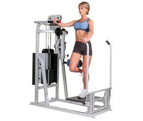 A woman is standing on a Life Fitness PRO Multi Hip - Remanufactured exercise machine.