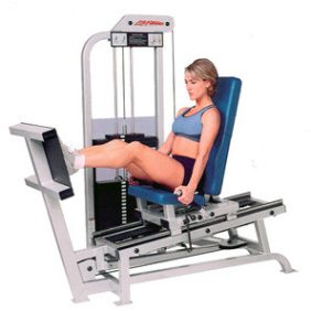 A woman is sitting on a Life Fitness PRO Seated Leg Press - Remanufactured in a gym, utilizing the newly remanufactured equipment.