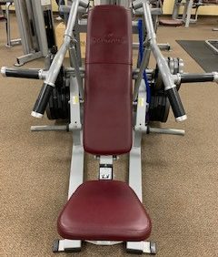 A Nautilus Xplode Vertical Chest Press - Remanufactured with a red seat available in new or remanufactured options.