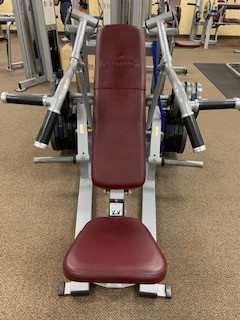 A Nautilus Xplode Vertical Chest Press - Remanufactured with a red seat available in new or remanufactured options.