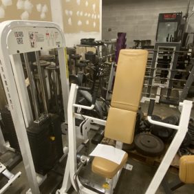 A gym featuring a diverse range of Paramount Seated Chest Press - As Is Functional gym equipment.