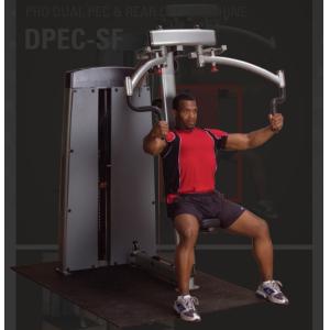 A man is doing a chest press on the Body Solid DPEC-SF Pro Dual Pec/Rear Delt Machine at the gym.