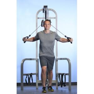 A man standing in front of a Muscle D Fitness High Low Pulley COMBO MACHINE.