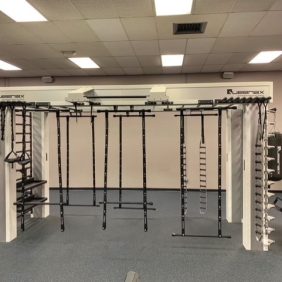 A gym with a lot of new and the Queenax Functional Training System - As Is Functional equipment in it.