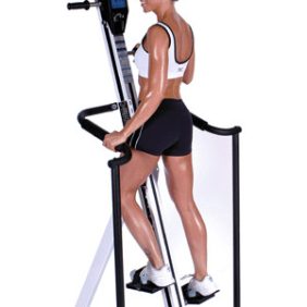 A woman is standing on the VersaClimber LXP - New exercise machine.