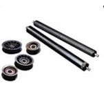 A group of new and remanufactured black rollers and rollers for gym equipment.