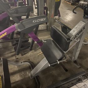 A collection of new gym equipment in a gym.