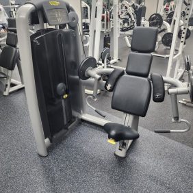 A gym featuring the Technogym Bicep - As Is Functional exercise equipment.