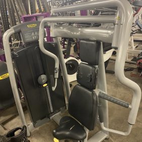 A room equipped with the Technogym Chest Press - As Is Functional.