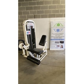 The gym's Star Trac Leg Extension - As Is Functional machine is located beneath a Fitness Plus banner, highlighting services such as equipment sales, flooring, and layout design.